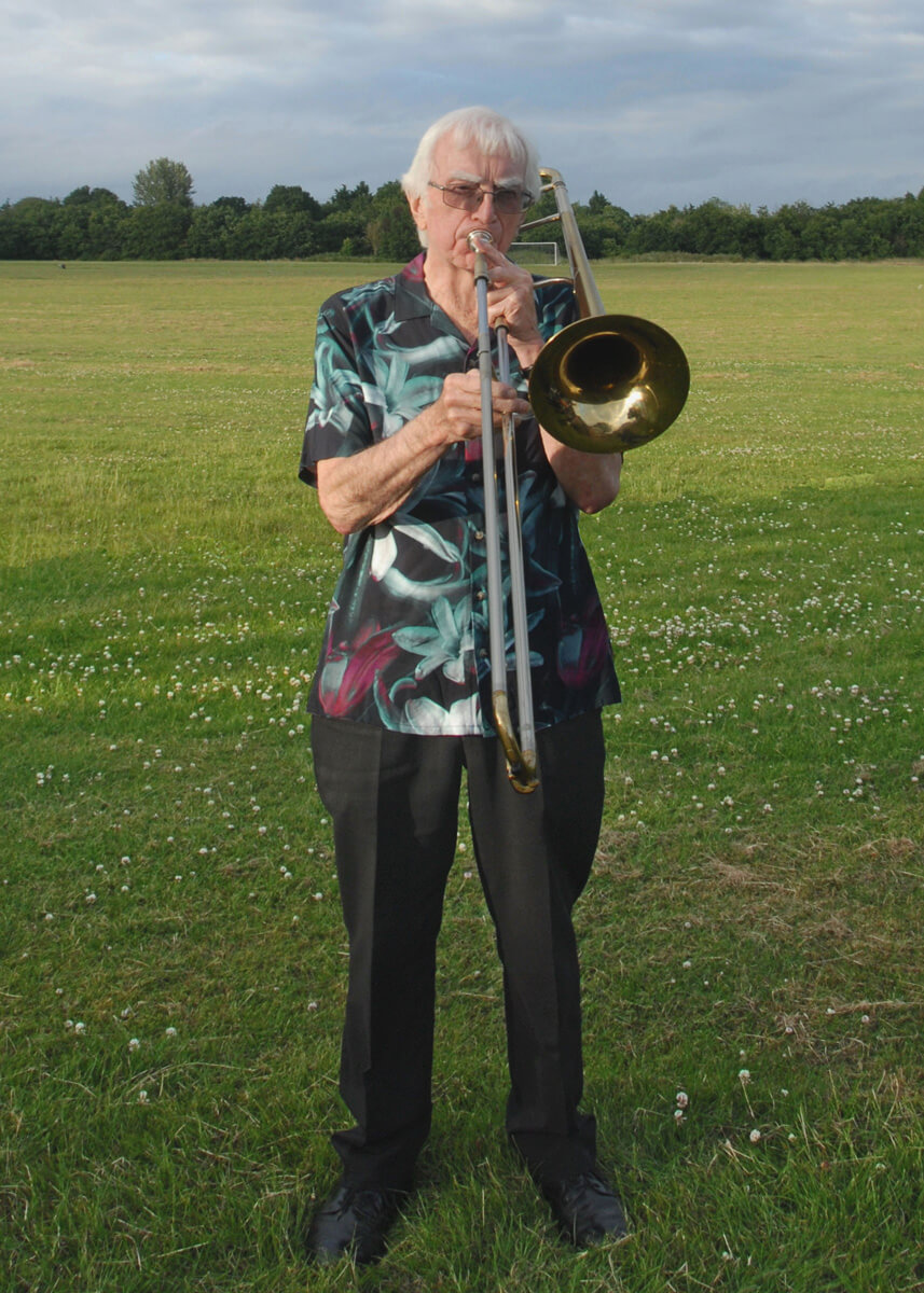 Colin Graham standing with trombone