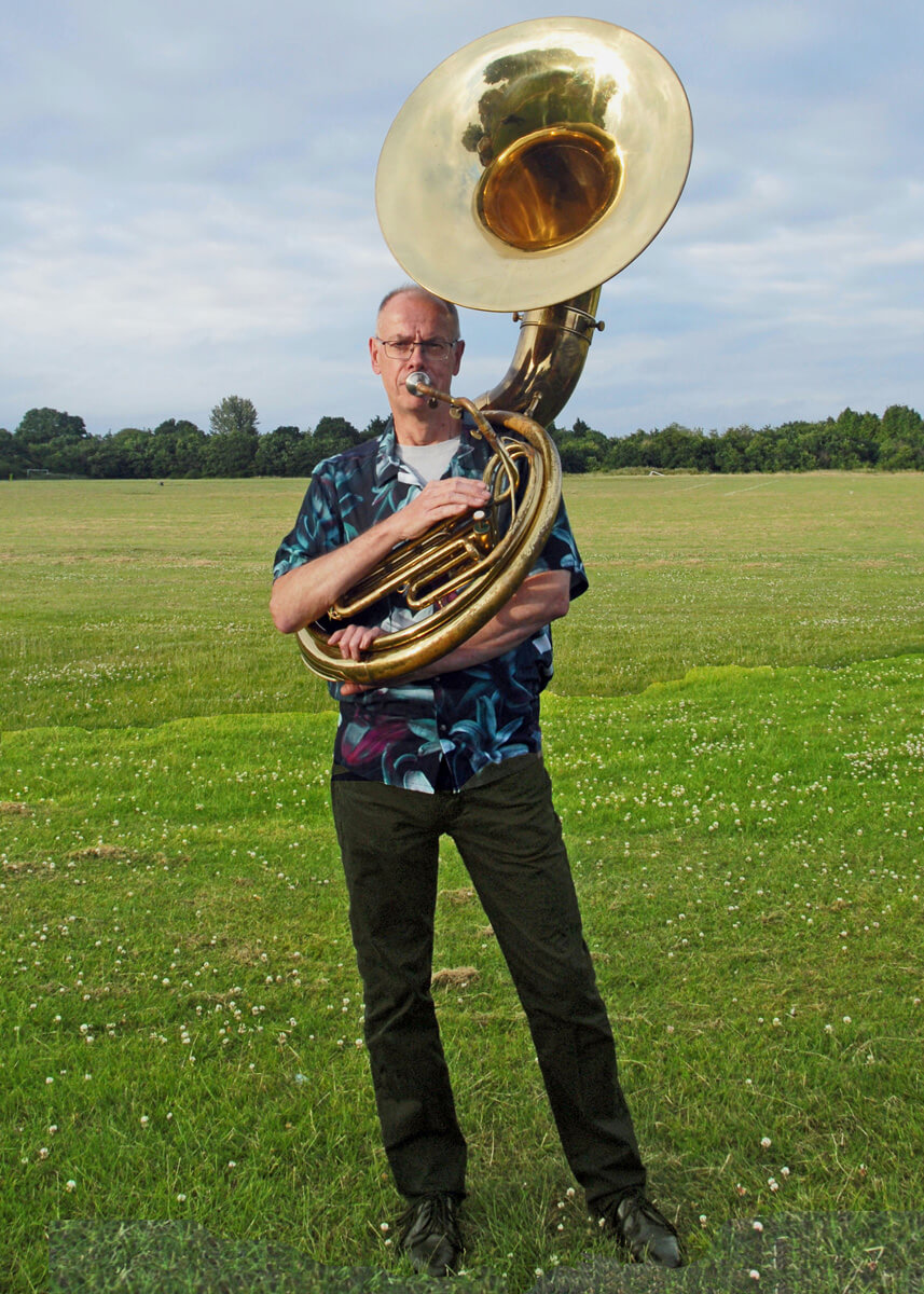Paul Busby standing with sousa